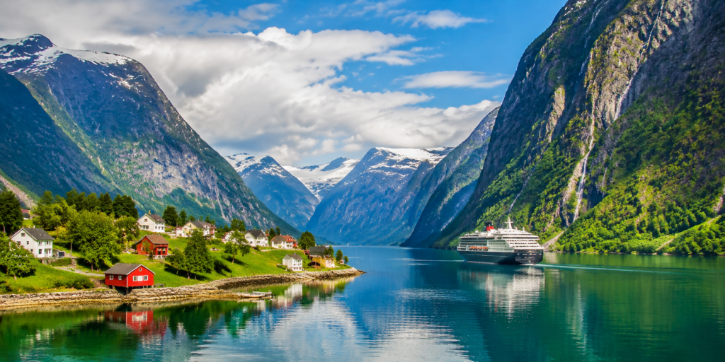 Scenic Nordic fjord landscape with calm water and mountains during cool summer travel